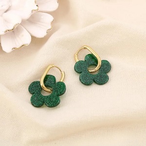 Boucles d’oreilles acier inox fleur résine pailletée verte